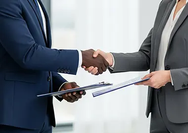 two men shaking hands after a MI trades digital website consultation.